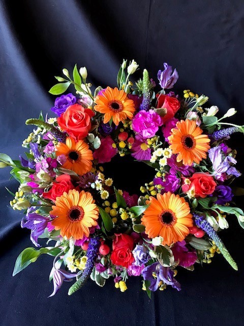 Colourful mixed funeral wreath