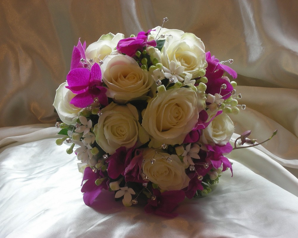 Bridal bouquet roses and orchid
